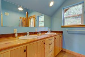 a bathroom with two sinks and a large mirror at The Osprey Perch in Garfield +74 photos