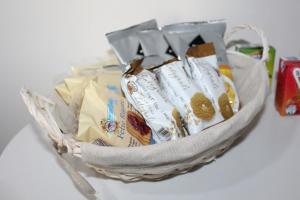 a basket filled with chips and other snacks at Loft vista mare in Silvi Marina