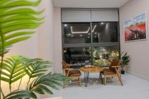 a dining room with a table and chairs at Bống's Homestay and Cafe in Ho Chi Minh City