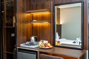 a bathroom with a counter with a bowl of fruit on it at Hotel Comfort Giza in Cairo +178 photos