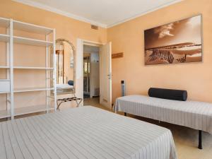 a room with two beds and a mirror at Casa Braun in Bonassola