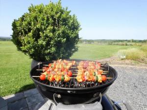 a grill with a bunch of food on it at Cocoon in Houffalize