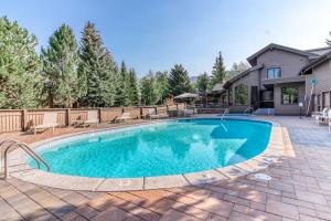 a swimming pool in front of a house at Snowcreek 1520 in Sun Valley