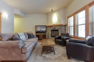 a living room with a couch and a fireplace at Lakeside Haven in Dover