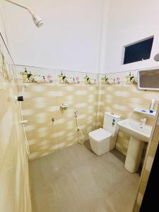 a bathroom with a toilet and a sink at Ima Manazil homestay in Kalpitiya +11 photos