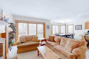 a living room with a couch and a table at Jay Peak Village Home 367A in Jay
