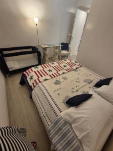 a bedroom with a large bed and a table at La Casa Sul Lago in Salò