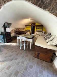 a room with a table and a dining room at Sparta Gaia Retreat in Áyios Dhimítrios