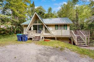 a home with a large deck and a porch at Ahmeek Retreat in Dover