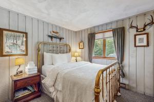 a bedroom with a large bed and a window at Ahmeek Retreat in Dover