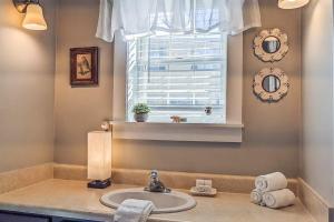 a bathroom with a sink and a window at Hoffman's Historical Gathering House at Okemo in Ludlow +103 photos
