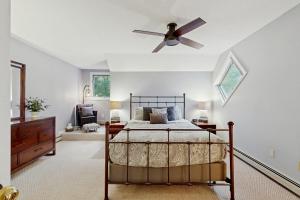 a bedroom with a bed and a ceiling fan at Newton Village 1A in Hartford +88 photos