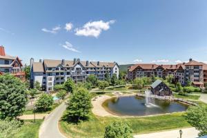 an aerial view of an apartment complex with a fountain at Long Trail House - 230 in Stratton