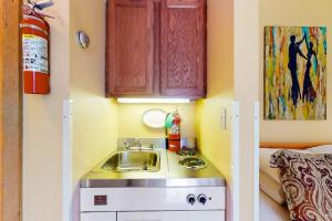 a small kitchen with a sink in a room at Kettle Brook A6 in Ludlow +70 photos