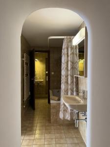 a bathroom with two sinks and a shower and a tub at Casa Chatelain in Ronco sopra Ascona +27 photos