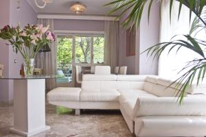 a living room with a white couch and a table at Luxury Property in Vatican Area in Rome