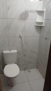 a bathroom with a toilet and a shower stall at Villa Penelope in Paracuru +13 photos