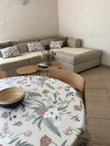 a living room with a couch and a table at Novia Apartment 22 in Đenovići