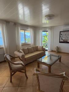 a living room with a couch and a table at Casa Chatelain in Ronco sopra Ascona