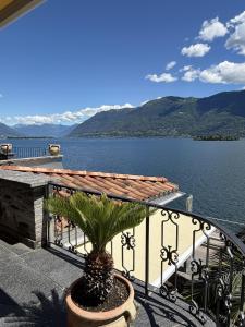 a balcony with a view of a lake and mountains at Casa Chatelain in Ronco sopra Ascona