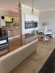 a kitchen and dining room with a counter top at 3 Bedroom - Salt Rock Beach Pad in Ballito +33 photos