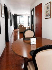 a dining room with a table and chairs at Morada Living Bello HomeStay in Bello