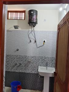 a bathroom with a shower and a sink and a tub at Himalayan due lodge chopta in Sari
