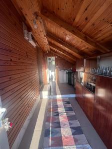 a hallway in a house with a wooden wall at Konak Vrela Žabljak in Žabljak