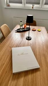 a table with a laptop on top of it at Penthouse am Kurparkweiher in Bad Schwalbach