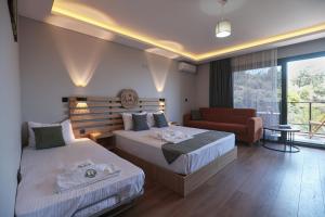 a hotel room with two beds and a couch at Helios Kaz Dağları blok2 in Uçurumoba +22 photos