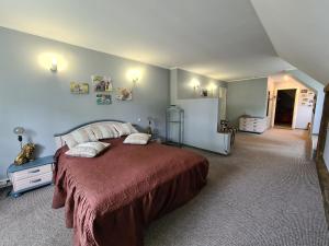 a bedroom with a large bed in a room at Nicava in Nīca +3 photos