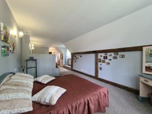 a bedroom with a bed with two pillows on it at Nicava in Nīca