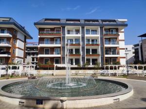 a water fountain in front of a building at Best Home 38 Triumph in Alanya