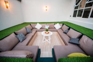 a living room with a couch and a table at Heaven Hill Apartment in Arusha