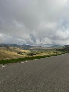 an empty road in the middle of a field at Motobike Experience in Arkos
