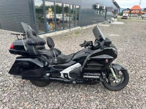 a black motorcycle parked in front of a building at Motobike Experience in Arkos