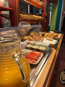 a buffet line with food and pastries on a table at Quick Palace St Jean De Vedas - A709 in Saint-Jean-de-Védas +10 photos