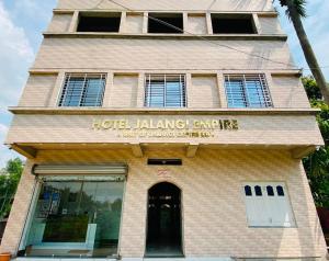 a building with a hotel lending agency sign on it at Jalangi Empire in mayapur