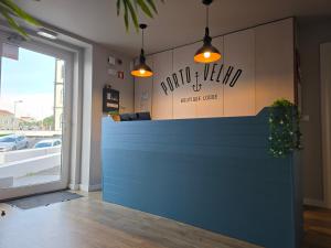 a lobby with a blue counter in a store at Porto Velho Boutique Lodge in Madalena
