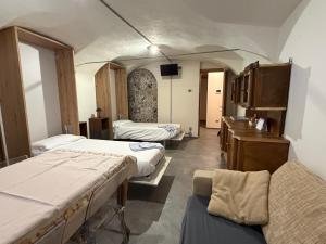 a hospital room with two beds and a desk at B&B Scarpo & Supel in Nona