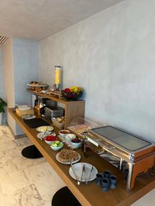 a kitchen with a table with food on it at Theta Boutique Hotel in Chania