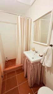 a bathroom with a sink and a mirror at Casa da Rigueira in Moreira do Lima +29 photos