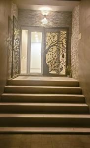 a set of stairs with a door and a window at Dolce Luna in Isola Sacra