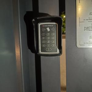 a cell phone is attached to a wall at Dolce Luna in Isola Sacra