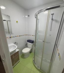 a bathroom with a toilet and a sink and a shower at Badalona Old Town Dalt de la Vila in Badalona