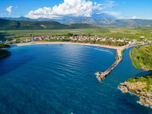 an aerial view of a beach with a group of houses at Anemoessa in Ammoudia