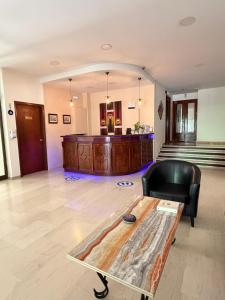 a living room with a couch and a coffee table at Paradise Hotel in Kos