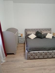 a bedroom with a bed with two pillows on it at FeWoZentrum in Lüdenscheid
