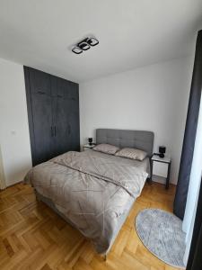 a bedroom with a large bed in a room at Azure Coast in Bar