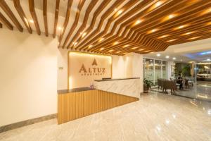 a lobby of a hotel with a reception desk at Altuz Apartment Seturan Yogyakarta in Seturan +34 photos